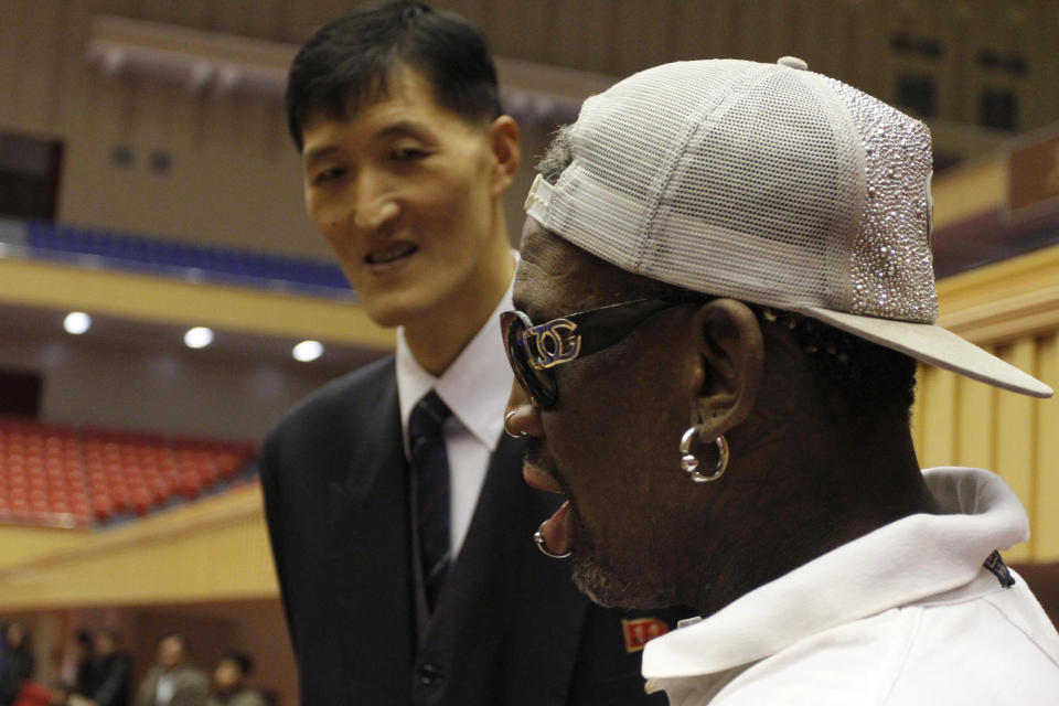 Dennis Rodman, right, meets with former North Korean basketball player Ri Myung Hun at a practice session with USA and North Korean players in Pyongyang, North Korea on Tuesday, Jan. 7, 2014. Rodman came to the North Korean capital with a squad of USA basketball stars for an exhibition game on Jan. 8, the birthday of North Korean leader Kim Jong Un. (AP Photo/Kim Kwang Hyon)