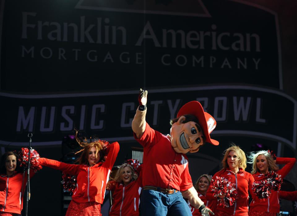 Dec 30, 2016; Nashville, TN, USA; The Nebraska Cornhuskers mascot and cheerleaders perform during a pep rally prior to the game against the Tennessee Volunteers at Nissan Stadium. Credit: Christopher Hanewinckel-USA TODAY Sports