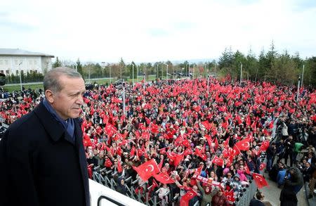 Turkish President Tayyip Erdogan addresses his supporters upon his arrival at Esenboga Airport in Ankara, Turkey, April 17, 2017. Yasin Bulbul/Presidential Palace/Handout via REUTERS