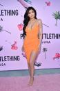 <p>Jenner wore an asymmetric, orange dress to the PrettyLittleThing.com #PLTxUSA launch party.</p>