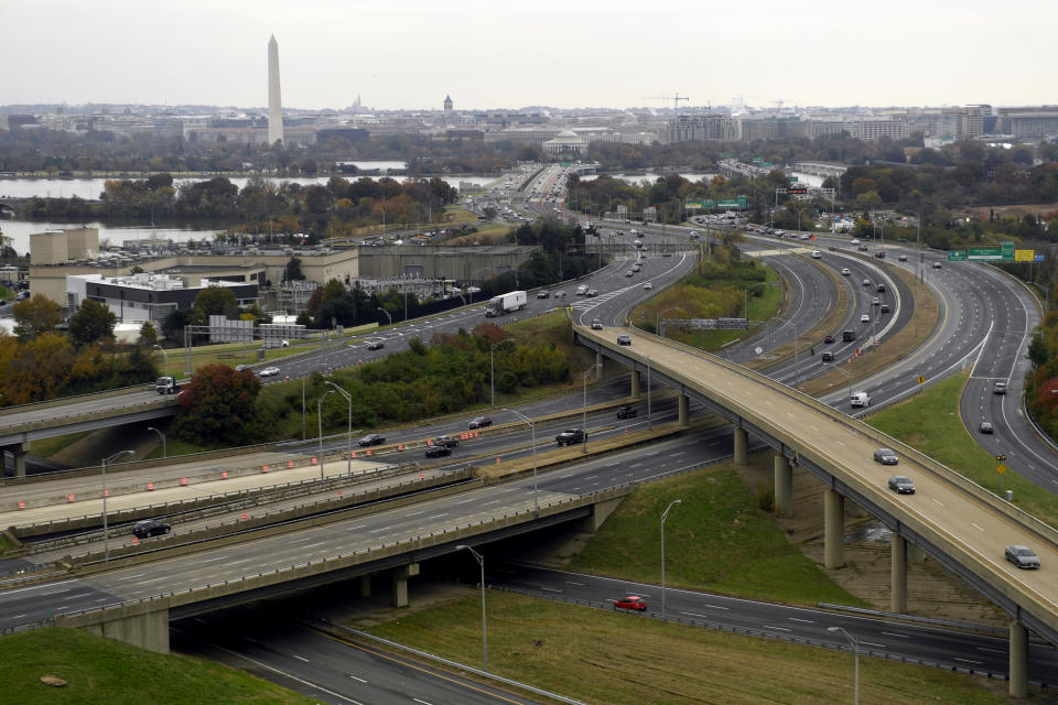 FILE- This Friday, Nov. 9, 2018, file photo, shows a view of Washington from a revolving restaurant in Crystal City, Va. On Tuesday, Nov. 13, Amazon said it will split its second headquarters between Long Island City in New York and Crystal City. Development along major highways in Northern Virginia and Washington have led to “unreasonable traffic delays on a daily basis” in the past few years, with drive times that used to take 40 minutes ballooning to up to 90 minutes, said Thomas Cooke, professor of business law at Georgetown University's McDonough School of Business. (AP Photo/Susan Walsh, File)