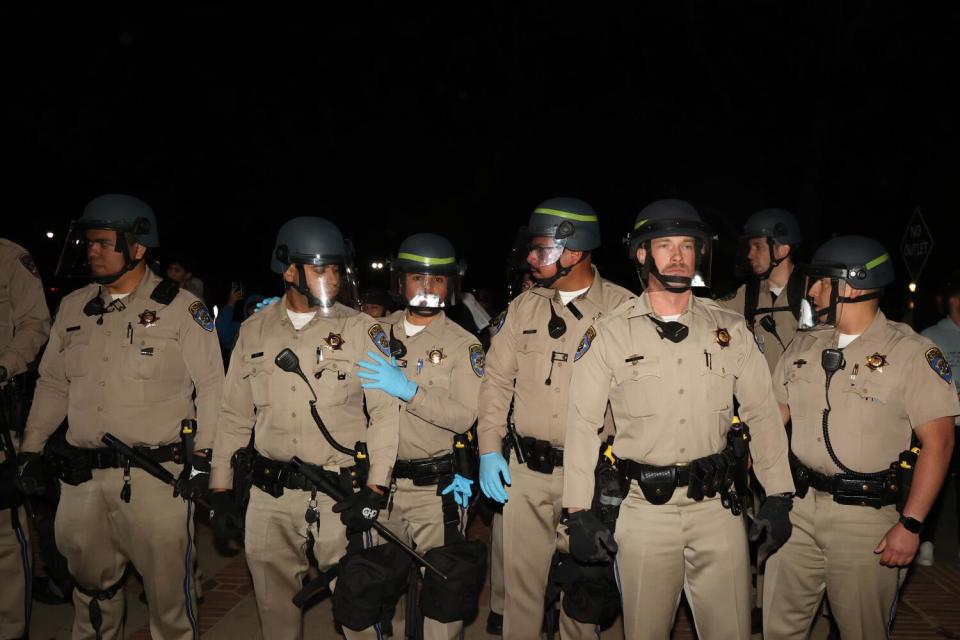 A line of California Highway Patrol officers