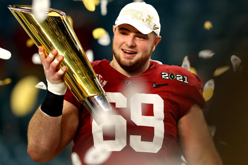 MIAMI GARDENS, FLORIDA - JANUARY 11: Landon Dickerson #69 of the Alabama Crimson Tide holds the trophy following the College Football Playoff National Championship game win over the Ohio State Buckeyes at Hard Rock Stadium on January 11, 2021 in Miami Gardens, Florida. (Photo by Kevin C. Cox/Getty Images)