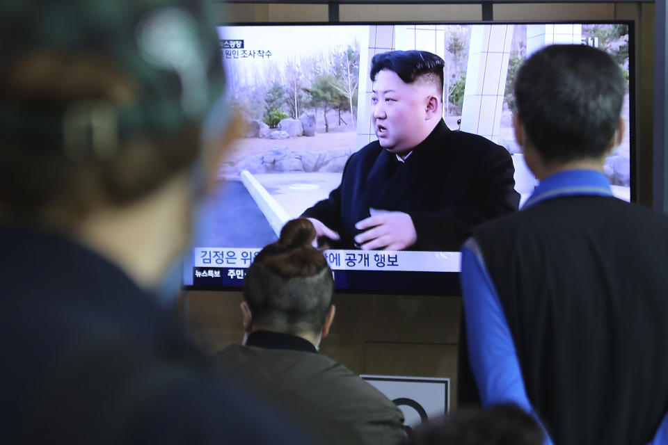 People watch a TV showing a file image of North Korean leader Kim Jong Un during a news program at the Seoul Railway Station in Seoul, South Korea, Saturday, May 2, 2020. Kim made his first public appearance in several weeks as he celebrated the completion of a fertilizer factory near Pyongyang, state media said Saturday, ending an absence that had triggered global rumors that he was seriously ill. (AP Photo/Ahn Young-joon)