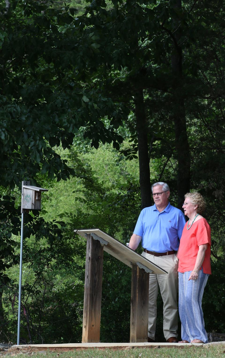Rob and Ginger Hinman check out the walking trail during Camp Hope Grand Reopening held Tuesday afternoon, July 12, 2022, at Camp Hope on River Run near Belmont.