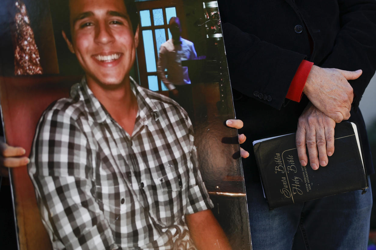 Joel Paez, father of Manuel Esteban Paez Terán, holds a bible during a press conference, Monday, March 13, 2023, in Decatur, Ga. A press conference was held to give additional autopsy findings in Terán's death. (AP Photo/Alex Slitz)