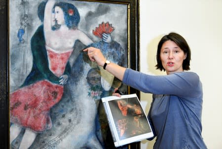 Conservator Meta Chavannes speaks about a study on a collection of Marc Chagall's artwork in the conservation atelier of the Stedelijk Museum in Amsterdam