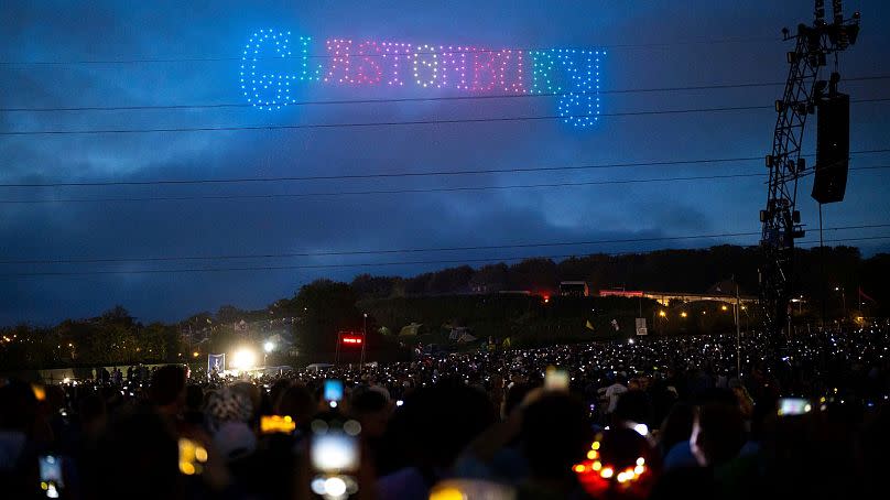 Drones fly above the Pyramid Field during the Glastonbury Festival in England.  