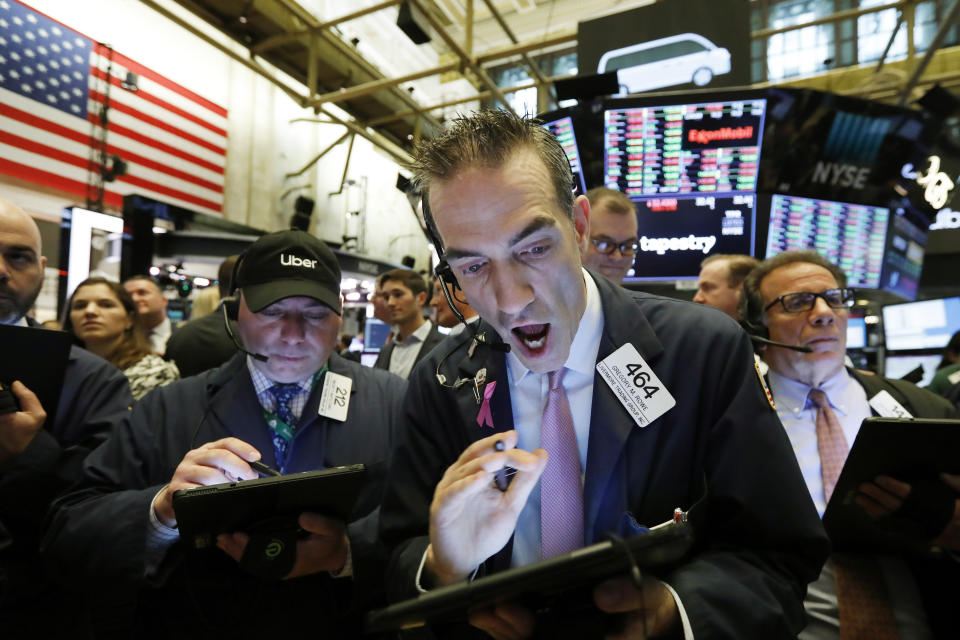 Stock trader Gregory Rowe works at the New York Stock Exchange, Friday, May 10, 2019. (AP Photo/Richard Drew)
