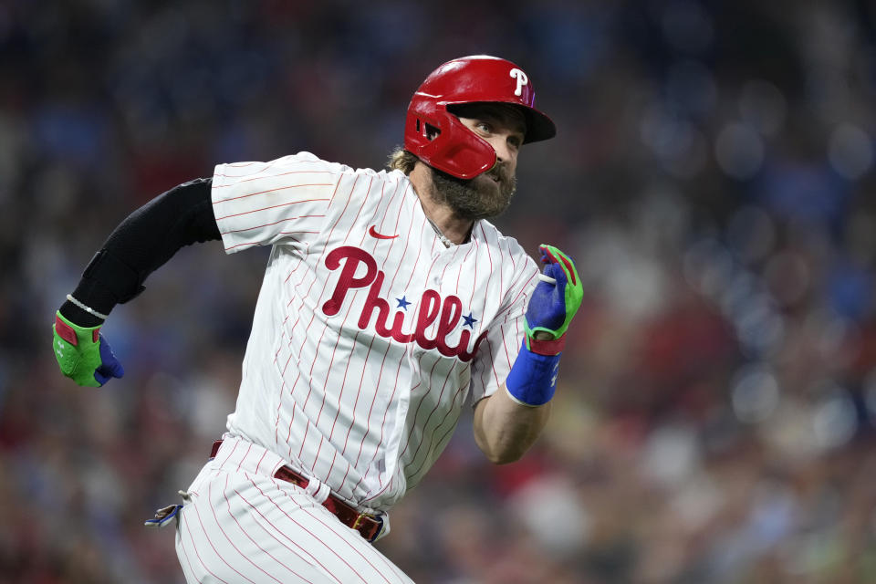 Philadelphia Phillies' Bryce Harper runs after hitting a triple against St. Louis Cardinals pitcher Andrew Suarez during the seventh inning of a baseball game, Friday, Aug. 25, 2023, in Philadelphia. (AP Photo/Matt Slocum)