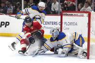 Buffalo Sabres goaltender Ukko-Pekka Luukkonen (1) defends the gaol against Florida Panthers center Kevin Stenlund (82) during the first period of an NHL hockey game, Saturday, April 13, 2024, in Sunrise, Fla. (AP Photo/Lynne Sladky)