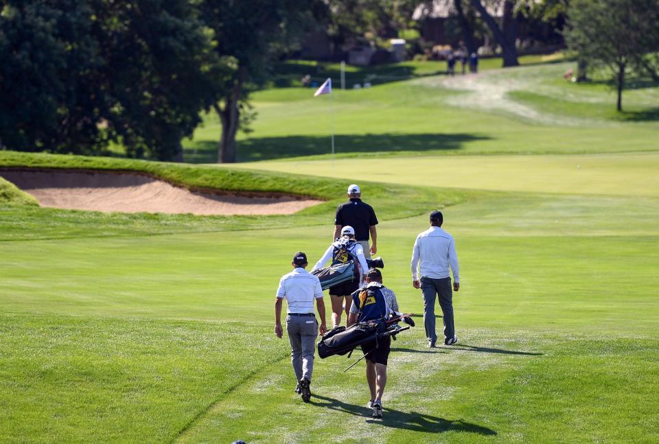 Jay Jurecic, lower left, walks down the fairway with the other members of his group during the first day of the Sanford International golf tournament on Friday, September 17, 2021, at the Minnehaha Country Club in Sioux Falls. Erin Bormett / Argus Leader
