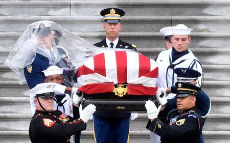 The casket of Senator John McCain, R-Ariz., is carried down the steps of the U.S. Capitol in Washington, U.S. September 1, 2018. Marvin Joseph/Pool via REUTERS