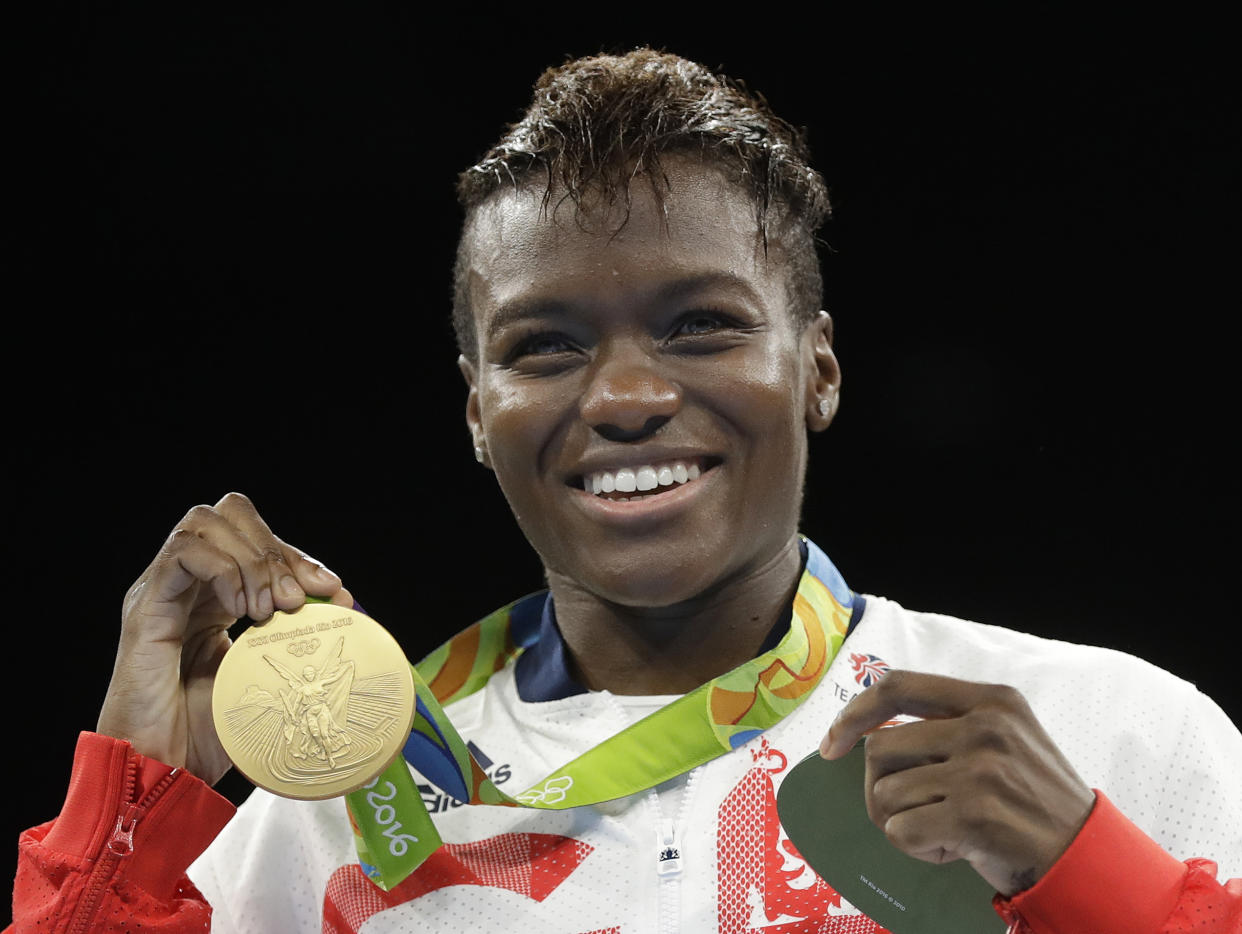 Britain's Nicola Adams displays her gold medal for the women's flyweight 51-kg boxing at the 2016 Summer Olympics in Rio de Janeiro, Brazil, Saturday, Aug. 20, 2016. (AP Photo/Frank Franklin II)