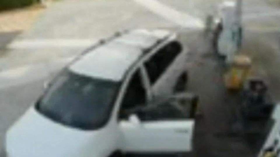 The mother falls from the car as it is being stolen. Picture: 9News