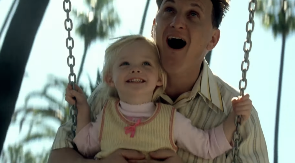 Lucy and Sam on the swings