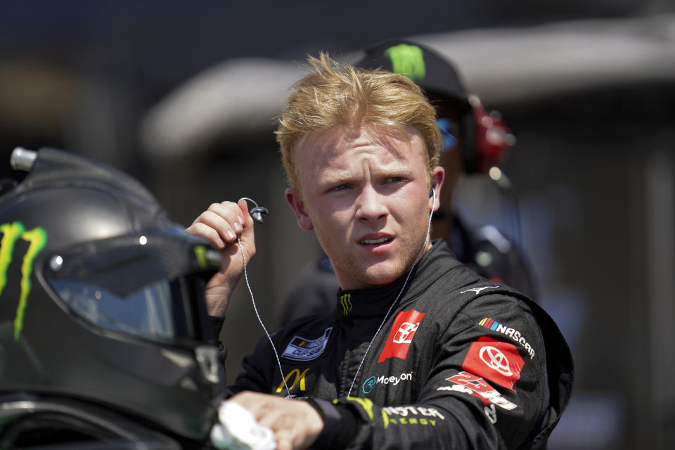 Ty Gibbs watches during NASCAR Cup Series auto race qualifying at the Michigan International Speedway in Brooklyn, Mich., Saturday, Aug. 6, 2022. (AP Photo/Paul Sancya)