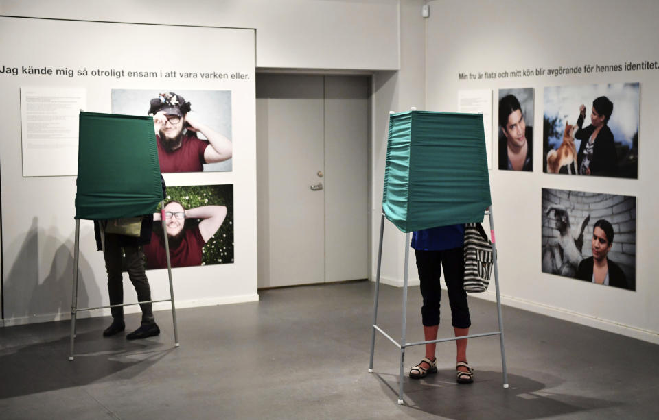 People cast their votes in Strangnas, Sweden, Sunday Sept. 9, 2018. Polls have opened in Sweden's general election in what is expected to be one of the most unpredictable and thrilling political races in Scandinavian country for decades amid heated discussion around top issue immigration. (Erik Simander/TT via AP)