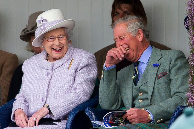Queen Elizabethe II, who had a keen sense of humour, seen here enjoying a joke with her son Prince Charles