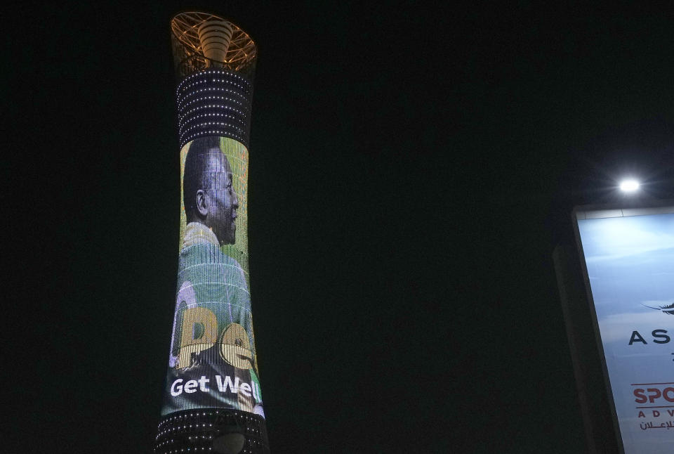 An image of former Brazilian player Pele with the message "Pele, Get well soon" is displayed on the Torch tower outside the Khalifa International Stadium in Doha, Qatar, Saturday, Dec. 3, 2022. (AP Photo/Hassan Ammar)