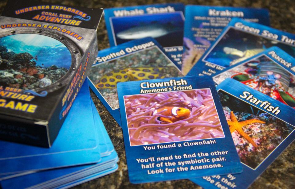 Undersea Explorers Coral Reef Adventure is a card game by Small Monsters Games that has players finding amazing creatures in the depths. The creators of Small Monsters are based in Fall River, and sell their decks locally.