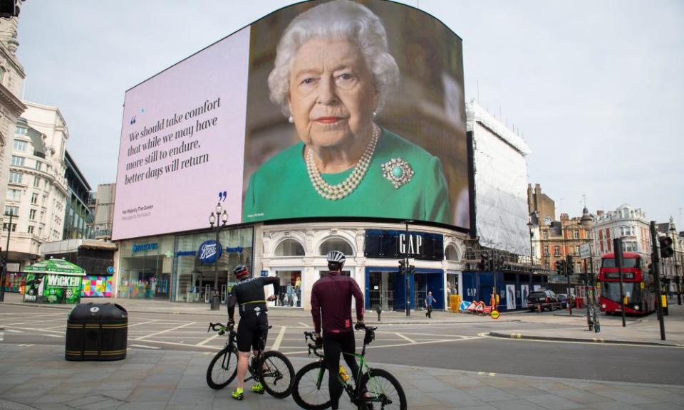 An image on a hoarding in London of the Queen broadcasting her message