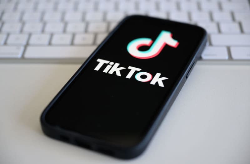 The logo of the short video platform TikTok is displayed on a smartphone. Robert Michael/dpa