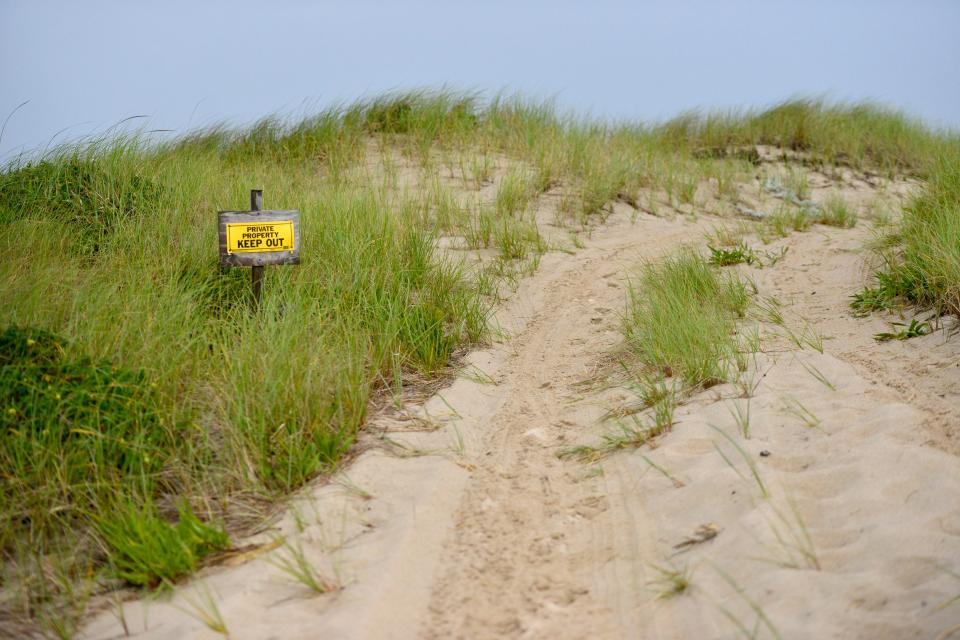 A sandy path leads to "Frenchie's Shack," one of the dune shacks on the Cape Cod National Seashore in Provincetown.