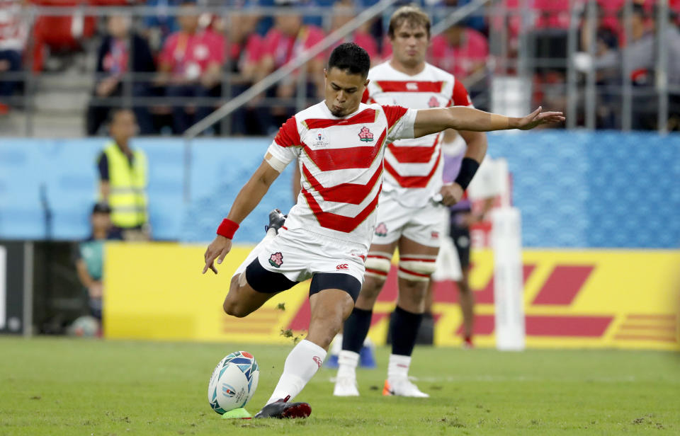 Japan's Yu Tamura kicks a penalty goal during the Rugby World Cup Pool A game at City of Toyota Stadium between Japan and Samoa in Tokyo City, Japan, Saturday, Oct. 5, 2019. (AP Photo/Shuji Kajiyama)