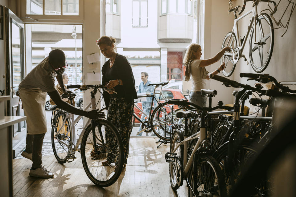 People with bikes indoors