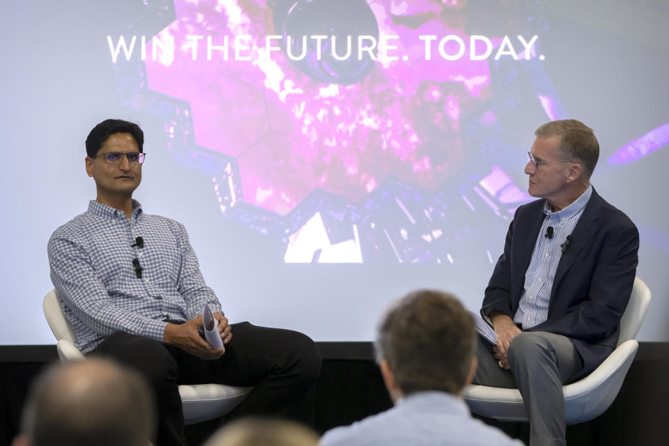 Anshu Roy, left, CEO of Rhombus Power, speaks with retired U.S. Army Gen. Stanley McChrystal, right, during a panel discussion at the AI Expo for National Competitiveness on Tuesday, May 7, 2024, in Washington. Rhombus Power used generative AI to predict Russia’s full-scale invasion of Ukraine with 80% certainty four months in advance. (AP Photo/Mark Schiefelbein)