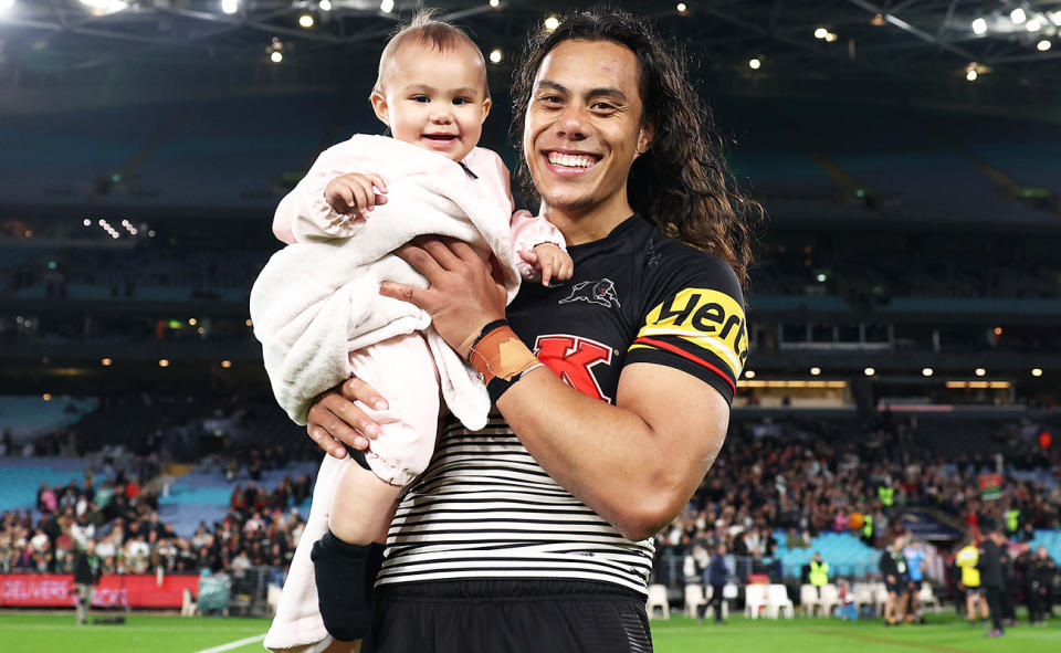 Jarome Luai and his baby, pictured here after a game for the Panthers in 2022.
