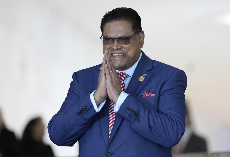 Suriname's President Chan Santokhi gestures upon arrival for the South American Summit at Itamaraty palace in Brasilia, Brazil, Tuesday, May 30, 2023. South America’s leaders are gathering as part of President Luiz Inácio Lula da Silva’s attempt to reinvigorate regional integration efforts.(AP Photo/Andre Penner)