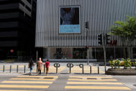 People crossing the street along Kuala Lumpur's Jalan Ampang on 18 March 2020, the first day of the Movement Control Order. (PHOTO: Fadza Ishak for Yahoo Malaysia)