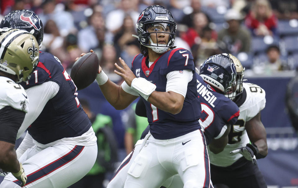 Oct 15, 2023; Houston, Texas, USA; Houston Texans quarterback C.J. Stroud (7) looks for an open receiver during the third quarter against the <a class="link " href="https://sports.yahoo.com/nfl/teams/new-orleans/" data-i13n="sec:content-canvas;subsec:anchor_text;elm:context_link" data-ylk="slk:New Orleans Saints;sec:content-canvas;subsec:anchor_text;elm:context_link;itc:0">New Orleans Saints</a> at NRG Stadium. Mandatory Credit: Troy Taormina-USA TODAY Sports