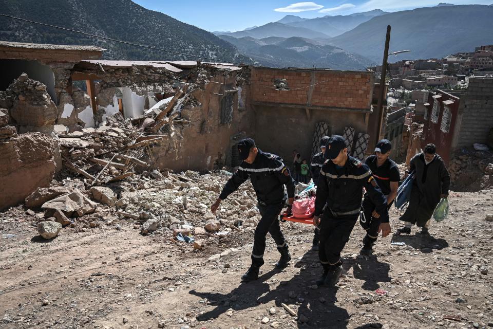 Emergency workers evacuate an injured survivor of the September 8 earthquake from the village of Moulay Brahim, in al-Haouz province in the High Atlas Mountains of central Morocco, Sept. 11, 2023. / Credit: PHILIPPE LOPEZ/AFP/Getty
