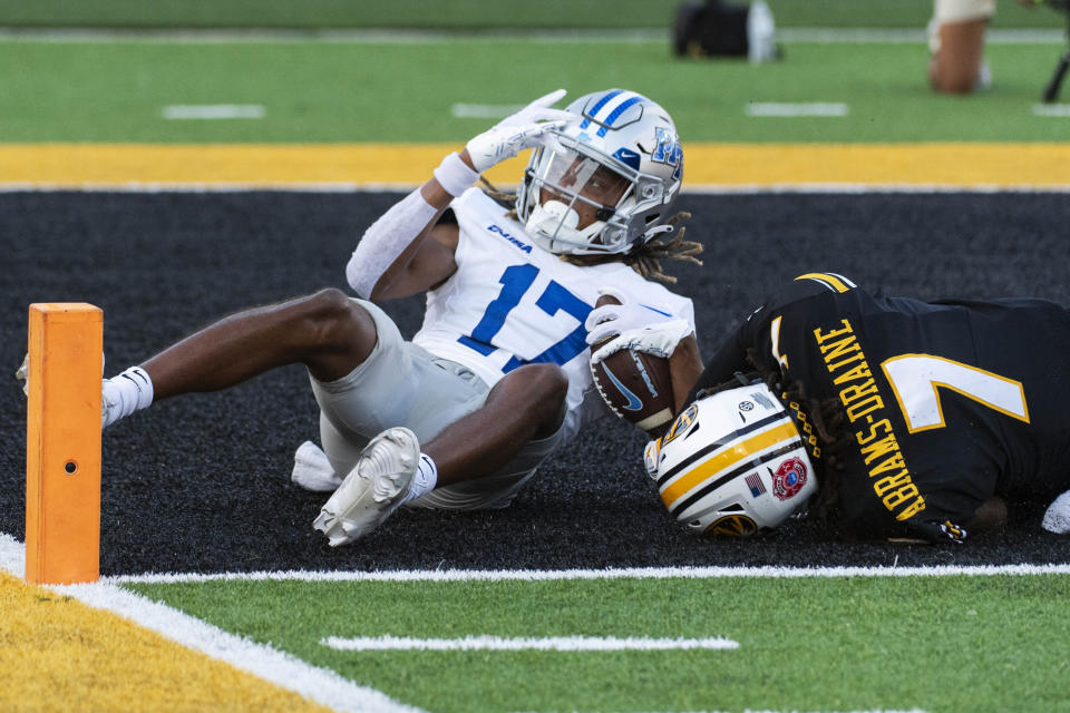 Middle Tennessee wide receiver Kalani Norris (17) scores a touchdown as he is tackled by Missouri's Kris Abrams-Draine (7) during the second quarter of an NCAA college football game Saturday, Sept. 9, 2023, in Columbia, Mo. (AP Photo/L.G. Patterson)