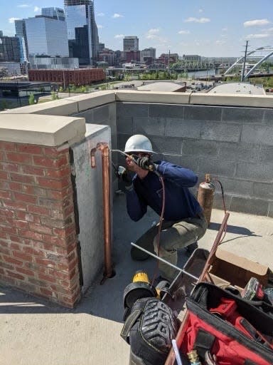 Prime Drain Cleaning and Plumbing Owner Brycen Sperlich works on a pipe in Nashville.