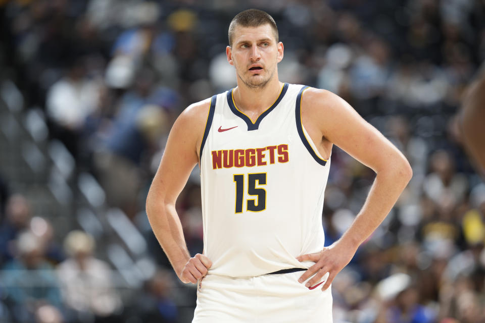 Denver Nuggets center Nikola Jokic waits for play to resume in the first half of a preseason NBA basketball game against the Chicago Bulls on Sunday, Oct. 15, 2023, in Denver. (AP Photo/David Zalubowski)