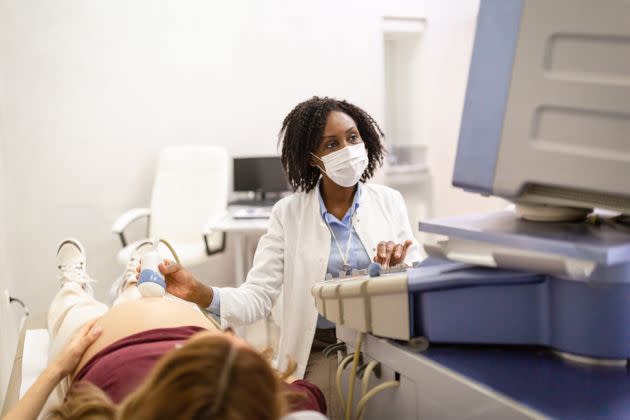 Health care workers can assess your symptoms and see if they're a risk with your pregnancy. (Photo: NoSystem images via Getty Images)