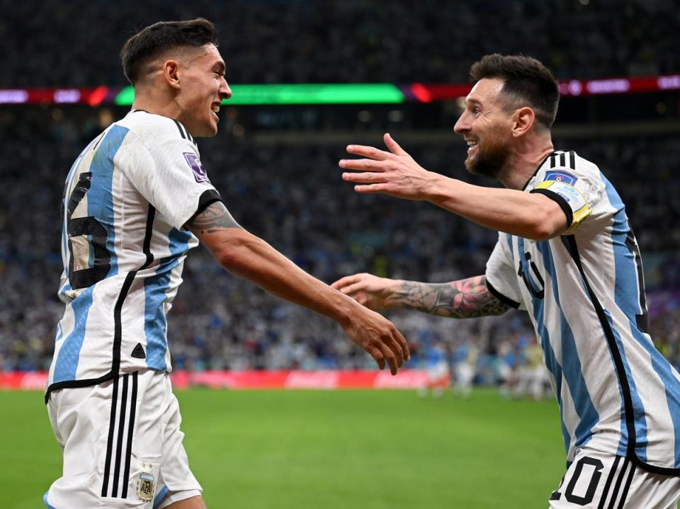 Nahuel Molina (left) celebrates his goal with Lionel Messi, who provided the assist (Getty Images)