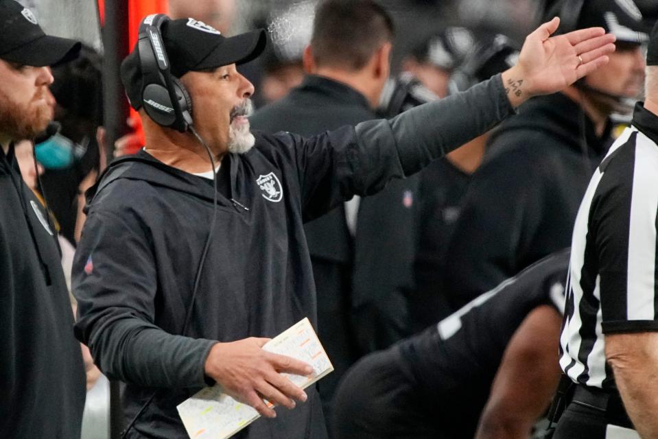 Las Vegas Raiders interim head coach Rich Bisaccia motions during the second half of the Raiders' game against the Denver Broncos, Sunday, Dec. 26, 2021, in Las Vegas. (AP Photo/Rick Scuteri)