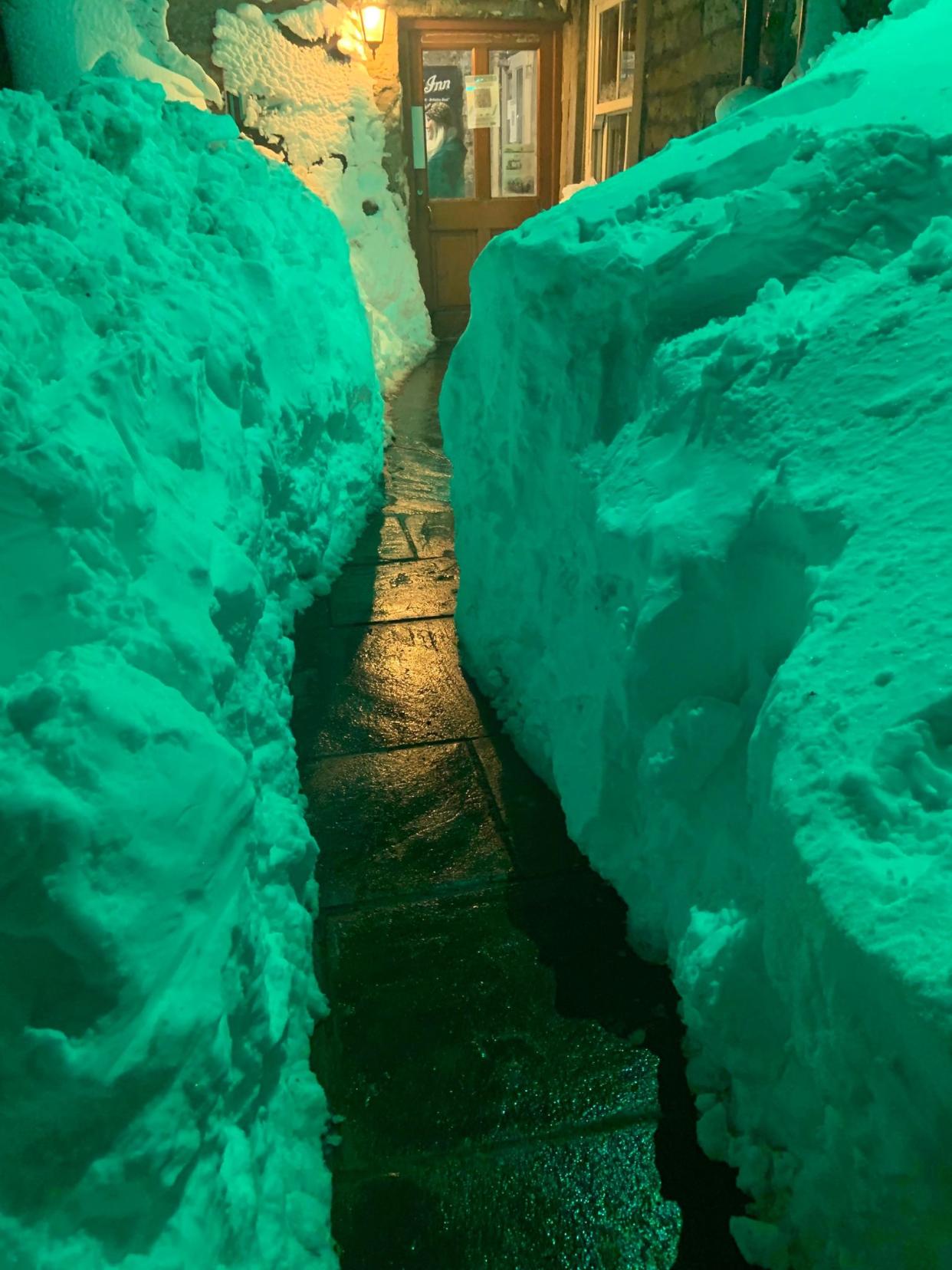 Stranded staff and guests dug a path out of the pub which had been blocked by thick snow. (Vicky Hodgson)