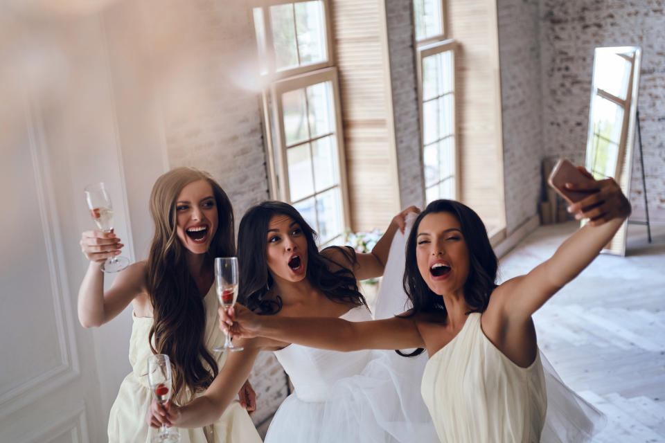 Don't post more than 5 pictures of your big day, says Tatler [Photo: Getty]