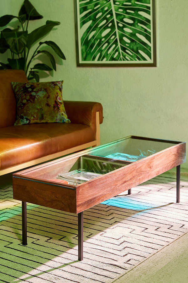 If your space is longer in length than width, <a href="https://www.urbanoutfitters.com/shop/shadowbox-coffee-table?category=tables&amp;color=020" target="_blank">this long coffee table</a> will seamlessly match your needs.