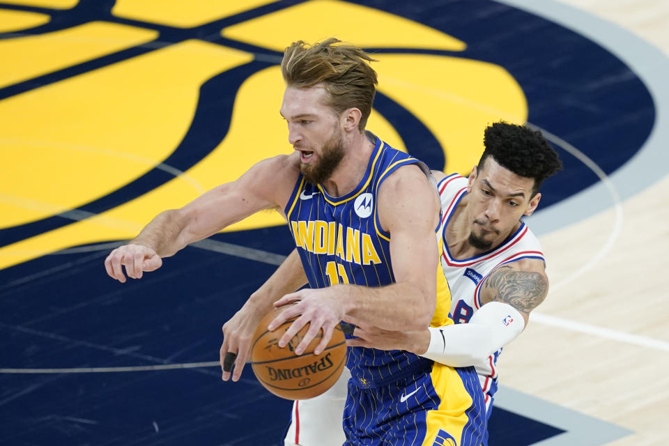 Indiana Pacers' Domantas Sabonis (11) is defended by Philadelphia 76ers' Danny Green (14) during the first half of an NBA basketball game, Sunday, Jan. 31, 2021, in Indianapolis. (AP Photo/Darron Cummings)