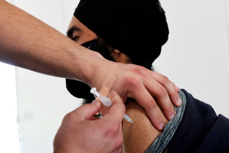 FILE PHOTO: Manitoba trucker gets COVID-19 vaccine in North Dakota