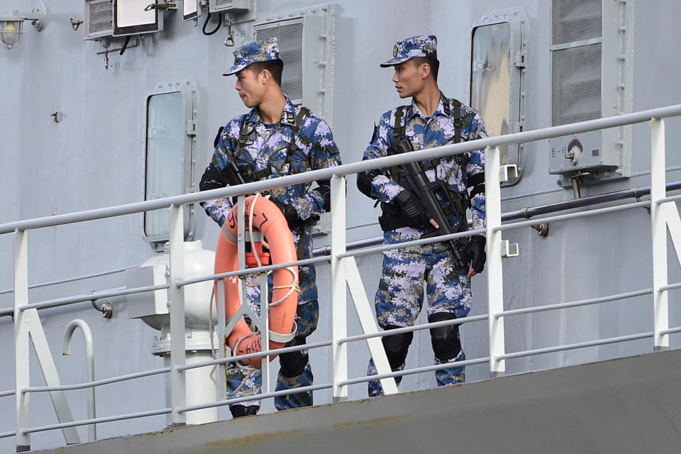 Chinese Navy personnel onboard a Chinese Navel ship after it arrived at Garden Island Naval Base on Monday. Source: AAP