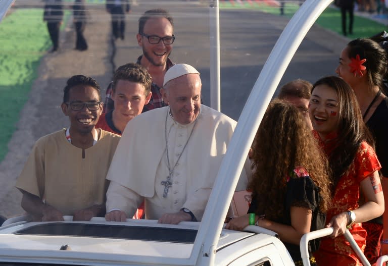 Pope Francis and young representatives of every continent arrive with the popemobil on July 30, 2016 on the Campus Misericordiae in Brzegi, Poland, ahead of a prayer Vigil, as part of the World Youth Days (WYD)