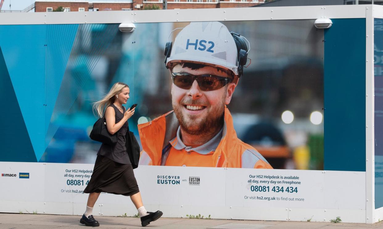 <span>Hoardings around Euston station in London, where work has been put on hold for two years.</span><span>Photograph: Maureen McLean/Shutterstock</span>